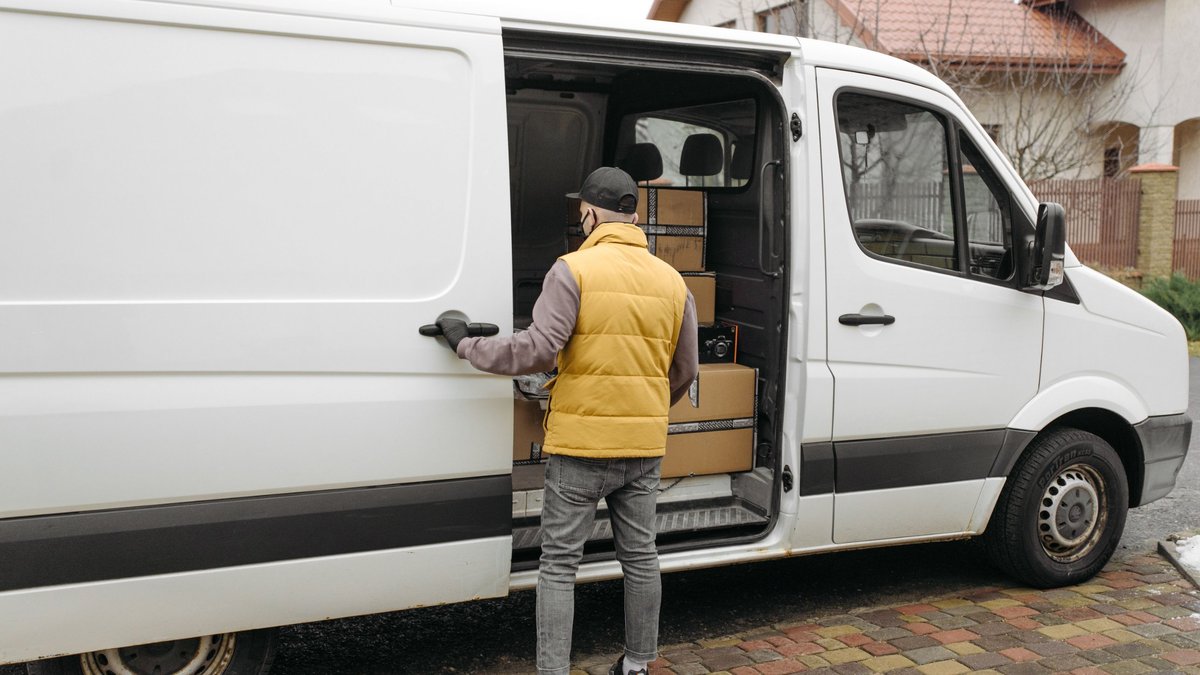 white-delivery-van-driver-loading-parcels